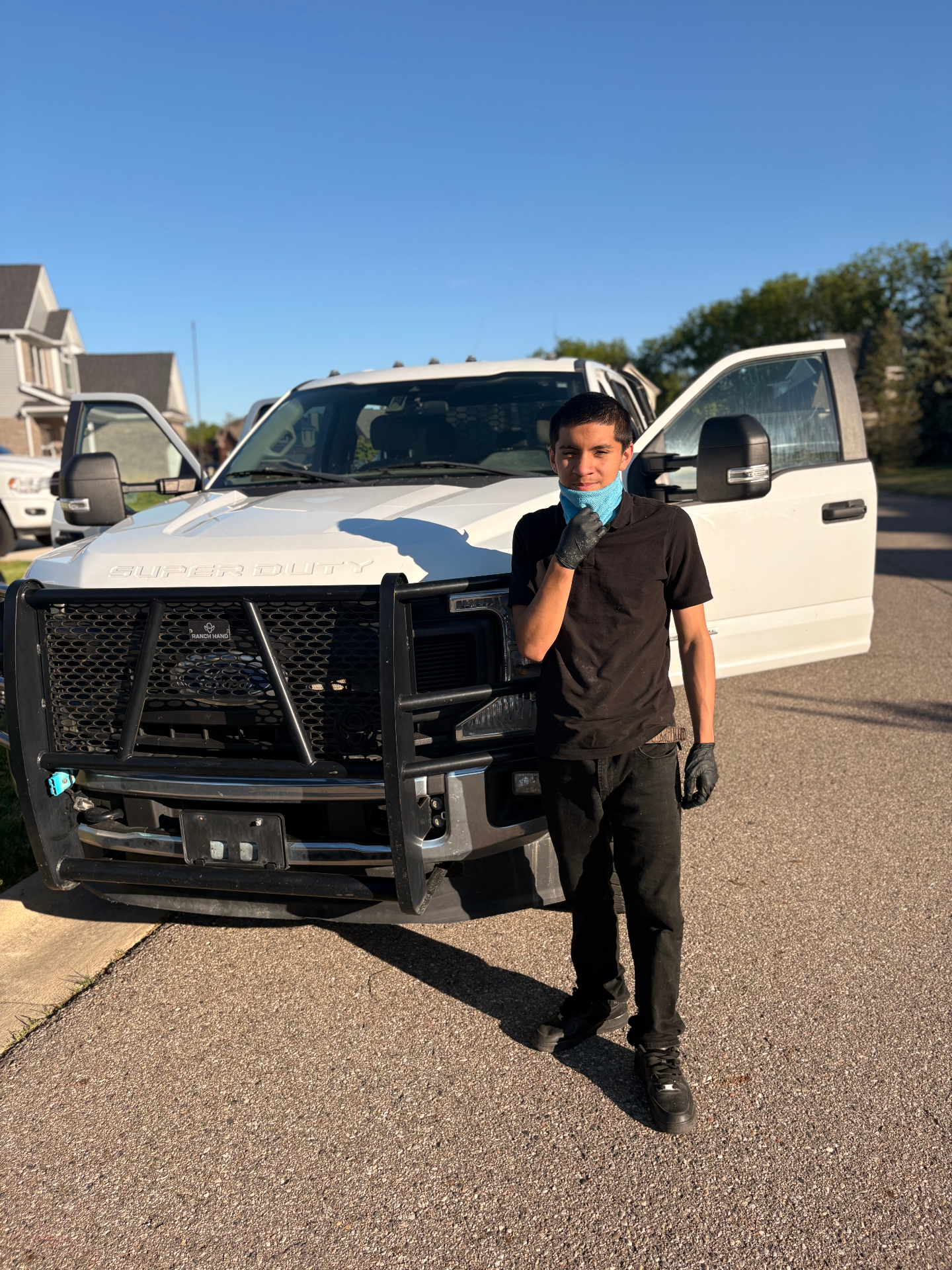 Alejandro detailing a white Super Duty truck